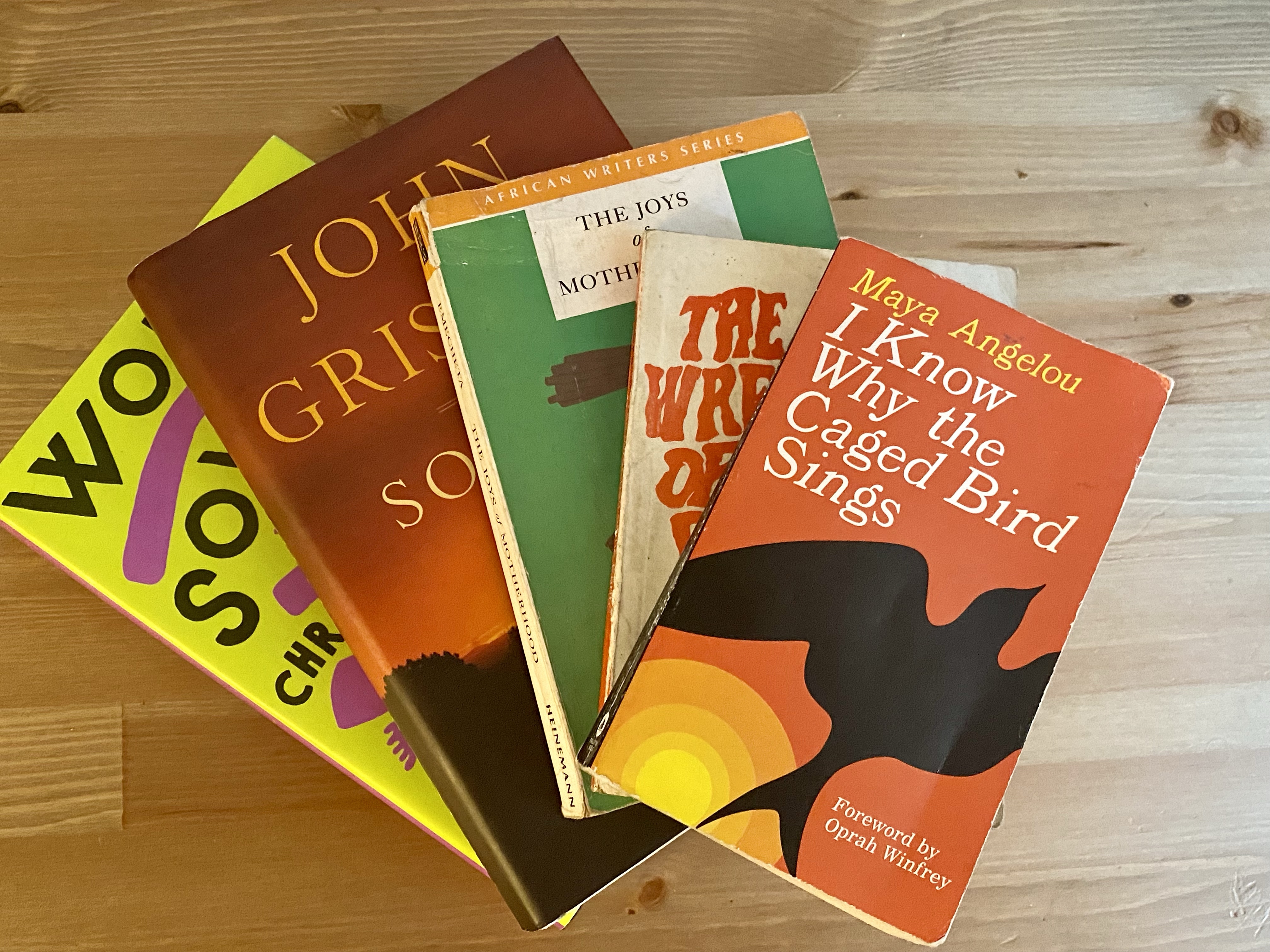 Several novels laid out on a table